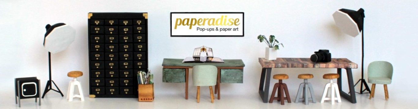 paper art & paper design Modernes paper art Zimmer mit Tischen, Stühlen, Lampen und dekorativer Wand aus Papier